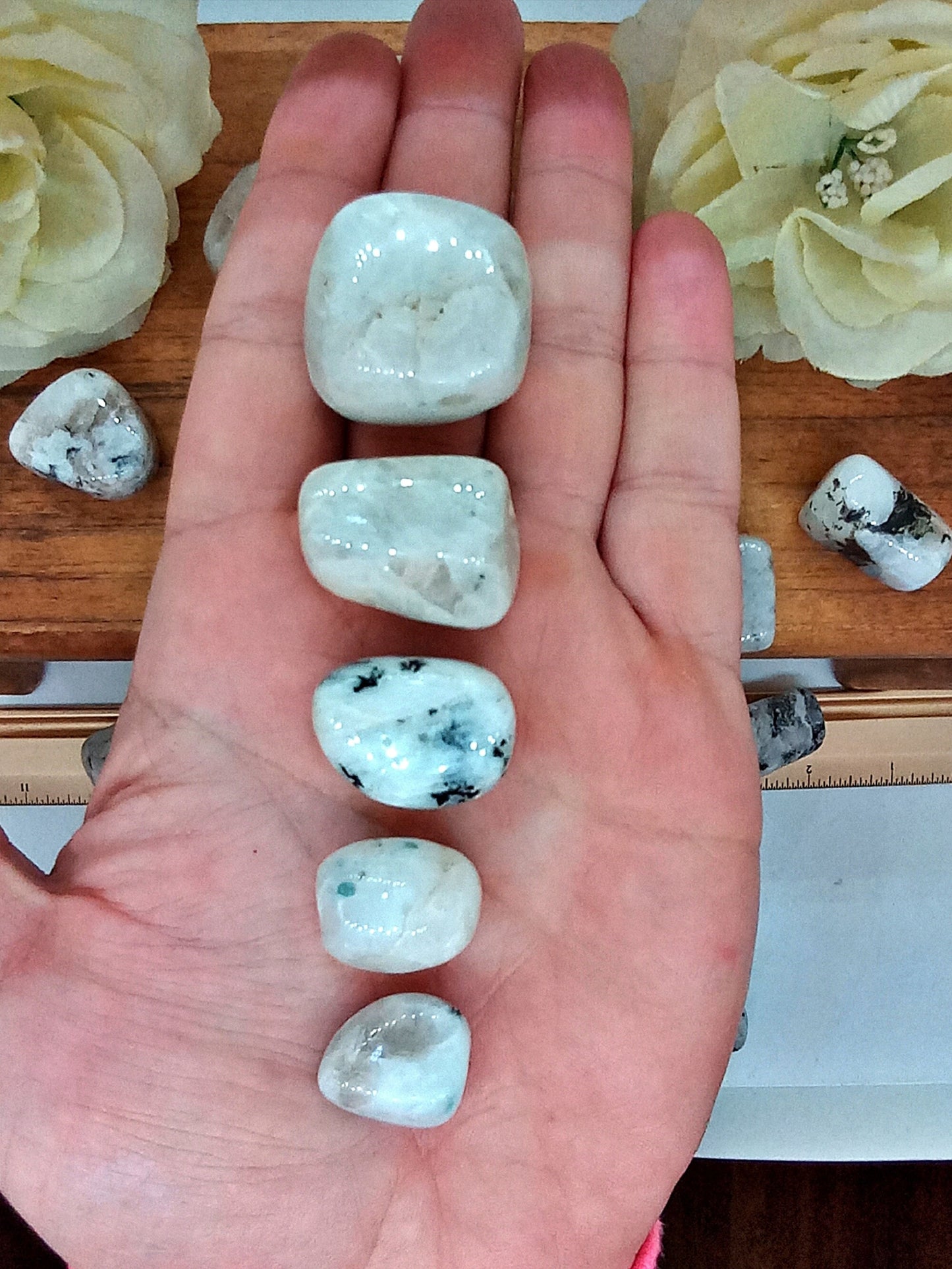 XQ Rainbow Moonstone Crystals! Choose from five (5) sizes of AAA-Grade, all natural, tumbled Extra High Quality Rainbow Moonstone stones.